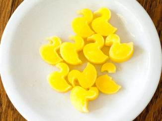 duck-shaped ice cubes made from 100 percent orange juice on a white plate