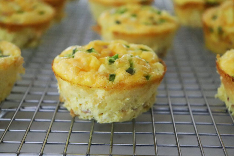 Ham and Cheese Egg Muffins cooling on a rack