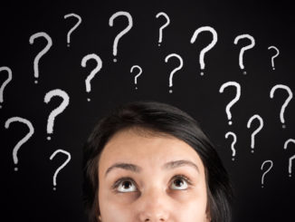 Woman's face surrounded by question marks