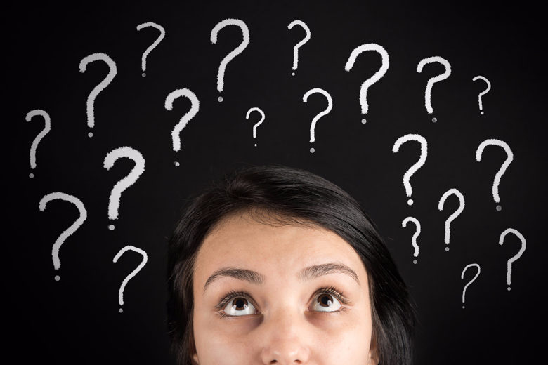 Woman's face surrounded by question marks