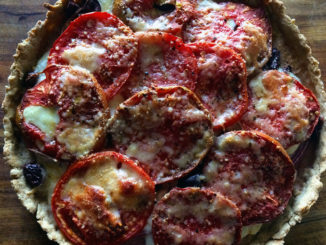 A fully baked Tomato Onion Tart with Olive Oil Crust shot from above.