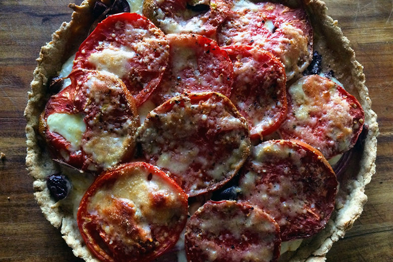 A fully baked Tomato Onion Tart with Olive Oil Crust shot from above.