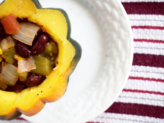 Acorn squash stuffed with vegan mix of vegetables and beans