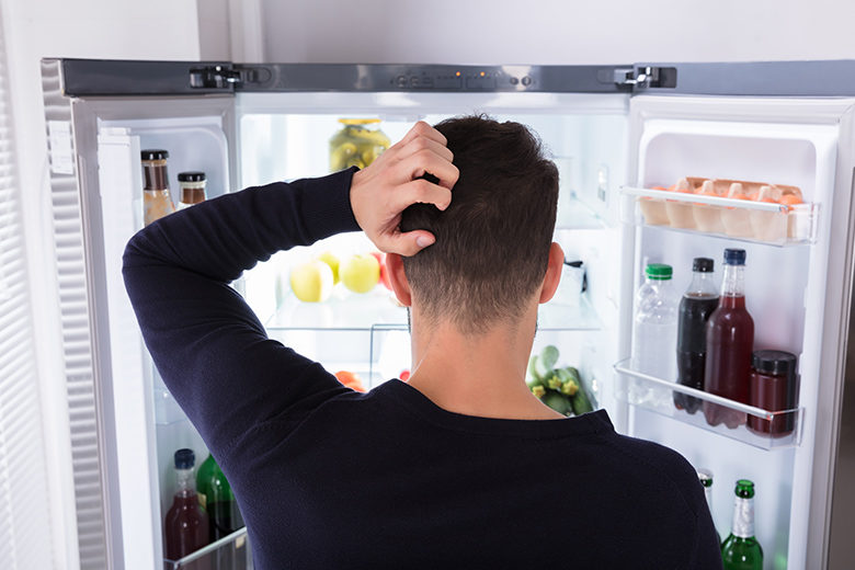 Man looking in Refrigerator