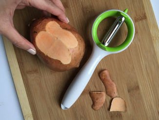 Urban Trends Ringo™ Multi-Peeler being used to peel a sweet potato