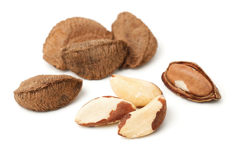 A bunch of nuts on a white background.
